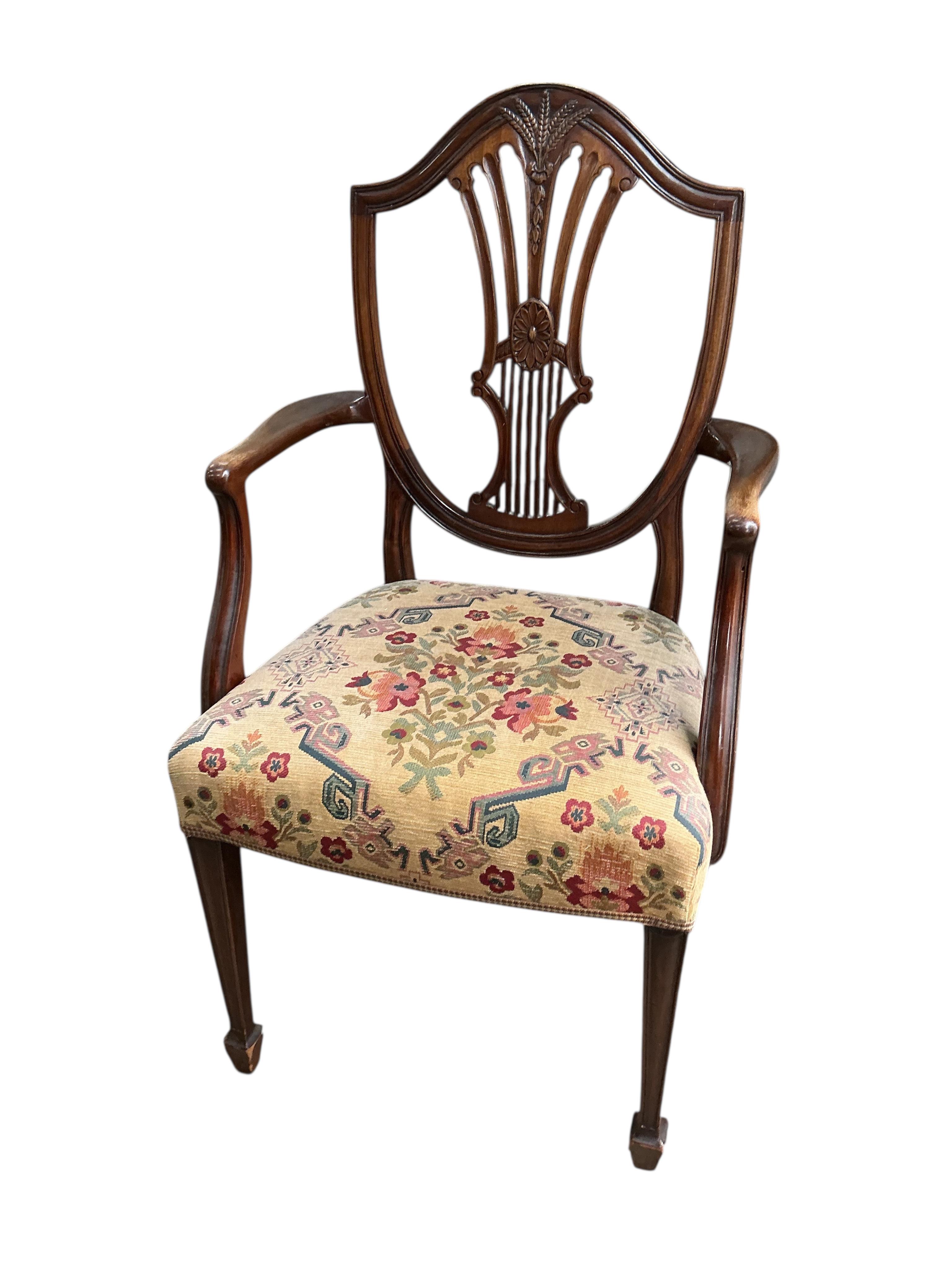 A set of eight George III style mahogany shield back dining chairs, two with arms